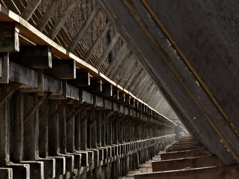 Old construction made of wooden logs, ..wooden logs covered with salt tarnish