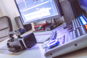 Professional cutting room for video editing and video producing: Monitors, camera and sound mixing