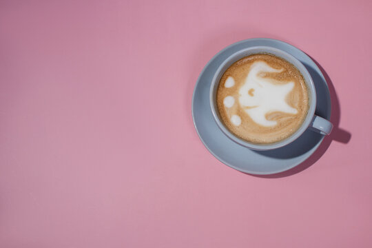 cute fish latte art coffee cup on pink background