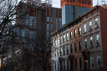 Row of Old Brownstone Homes with Modern Buildings and Construction in Prospect Heights of Brooklyn...