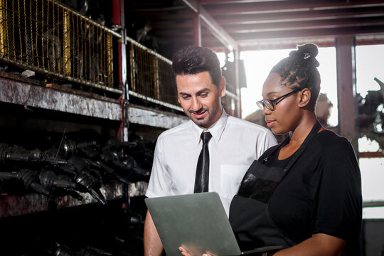 Happy Harmony People At Workplace, Smiling White Man And African American Worker Working Together A, Two People Checking Product Stock At Auto Spare Parts Store Shop Warehouse 
