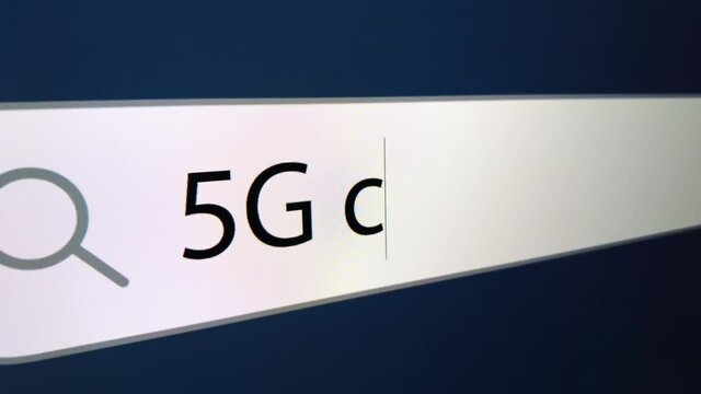 5G chipping written in search bar with cursor, computer monitor, close-up with camera zoom effect