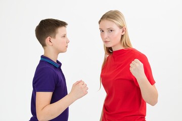 A girl and a boy sort out the relationship with a physical threat, close-up.