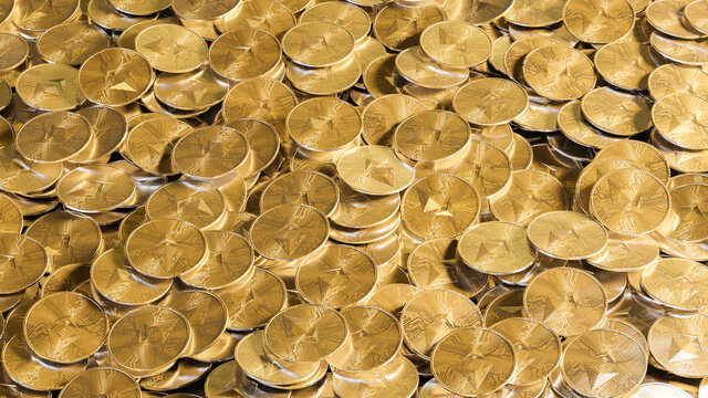 Groups of Etherum coins on table.