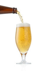 Pouring beer into glass over white background