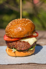 Delicious burger stacked high with a juicy beef