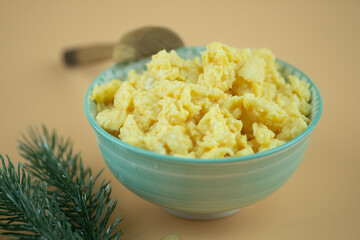 Close up view of fresh scrambled eggs in bowl