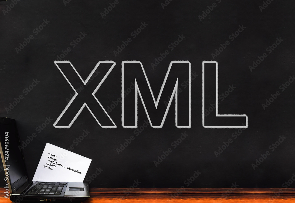 Poster extensible markup language. word xml on wall and laptop
