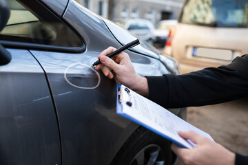 Insurance Agent Or Adjuster Inspecting Car - obrazy, fototapety, plakaty