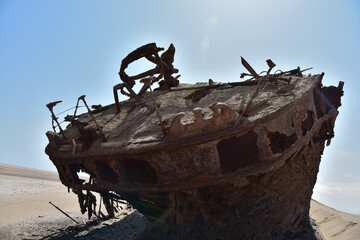 The rusty carcass of the Eduard Bohlen shipwreck up close in sand of the Namib Desert © Gerrit Rautenbach