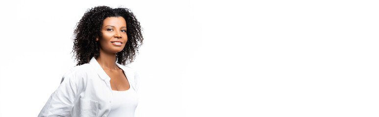 Curly african american woman smiling at camera isolated on white, banner