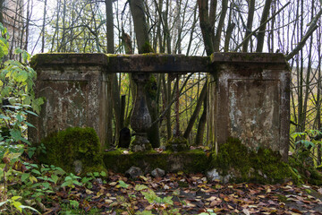 old stone fence overgrown with moss