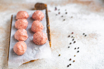 raw meatballs minced meat pork, beef, lamb, chicken meat cutlet healthy meal top view copy space for text food background rustic