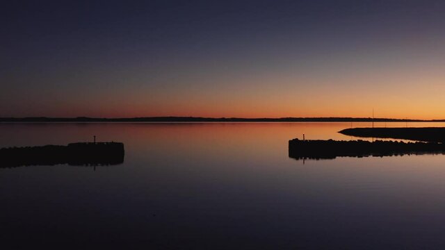 Drone Over Tranquil Waters At Sunset