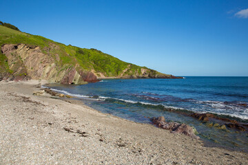 Fototapeta na wymiar Talland Bay beach Cornwall England UK with blue sea and waves