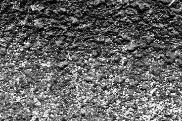 Texture of a concrete wall with cracks and scratches which can be used as a background