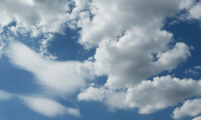Beautiful big fluffy clouds in the blue sky,  natural background 