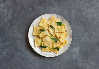 Ravioli with ricotta cheese, spinach and nuts. Healthy eating. Vegetarian food. Italian cuisine.