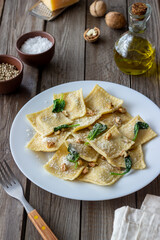 Ravioli with ricotta cheese, spinach and nuts. Healthy eating. Vegetarian food. Italian cuisine.