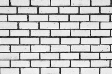 Texture of a brick wall with cracks and scratches which can be used as a background