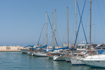 Fototapeta na wymiar Yachts in the bay of the Mediterranean Sea. Vacation on the sea