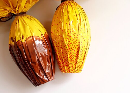 Brazilian Chocolate Easter eggs, wrapped in colorful papers. Easter in Brazil concept. Chocolate egg.
