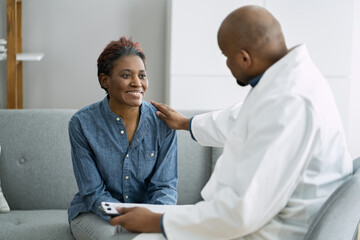 Doctor Talking With Elderly African Patient