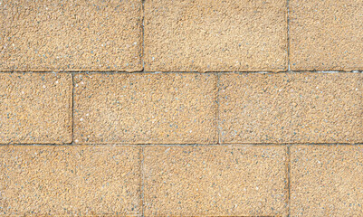 Texture of a gray - brown stone wall close-up. Stone wall background. Concrete surface backdrop. High quality photo