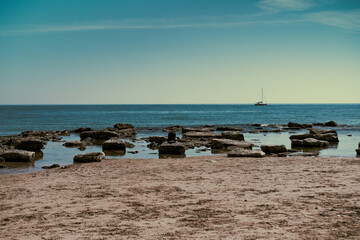 Sicily, April 2021 - Long shot of a beach in Sicily, sea rocks and good light