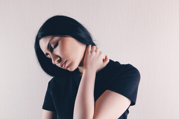 close-up on a woman's hand massaging her neck. Girl's neck hurts