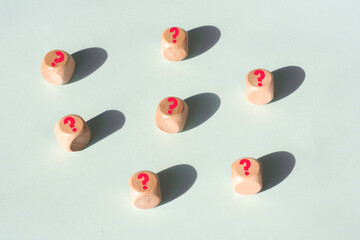 a question mark on wooden cubes . FAQ frequency asked questions, Answer Concepts