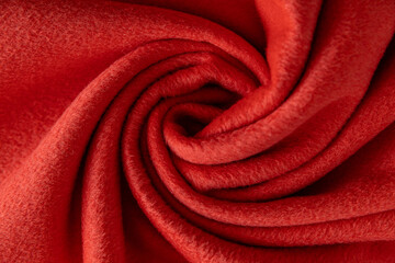 top view of bright red fleece coiled into a spiral