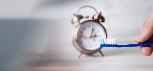 toothbrush and alarm clock time to brush your teeth