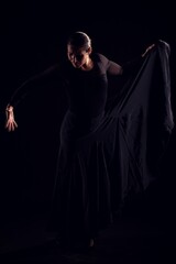 flamenco woman with black dress and hand gestures