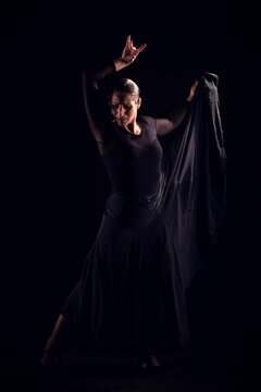 flamenco woman with black dress and look at the ground