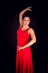 flamenco woman red skirt and sevillian position