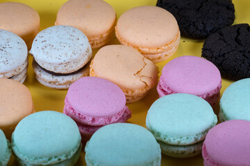 Fototapeta na wymiar Colorful and tasty Macaron cakes. Small French cakes. Background