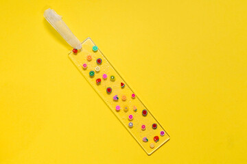 Handmade bookmark isolated on yellow background