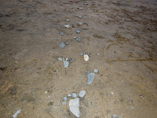 Rock foot imprints on the sand in Lake Tahoe. 