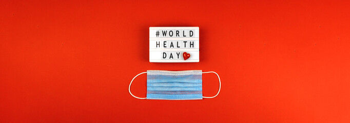 World health day 7th april banner with text message, red heart and medical mask, lifeinsurance and healthcare concept, copy space