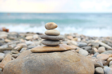 Fototapeta na wymiar Seashore and waves. Stones by the sea.