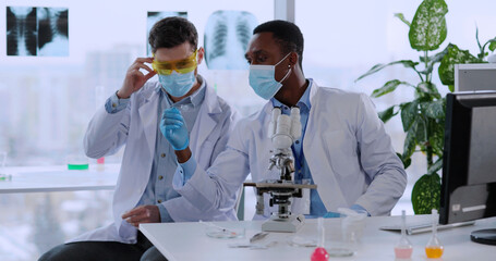 Couple of Multi-ethnic Scientists Developing New vaccine against Coronavirus Looking Very...