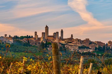 Fotobehang Toscane San Gimignano, Tuscany: November 10 2021: panorama of the city of towers in Tuscany in autumn  © DD25