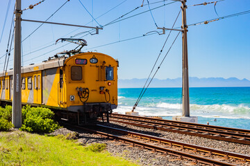 Passenger rail running through small coastal town of St James