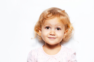 Studio portrait of blonde child girl on white background.