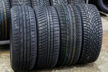 car tires with different treads for summer, all season, winter and winter with studs