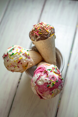 Assorted ice cream on wooden background