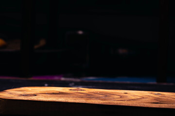 Fried potato spiral tubercle on wooden base and dark background