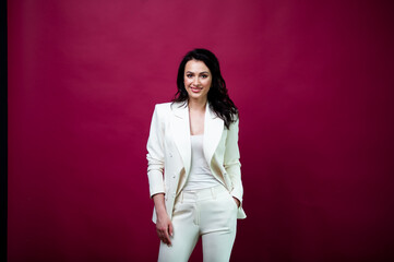 Businesswoman in a white shirt posing in the office smiling