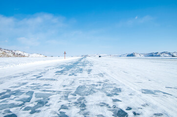 Ice surface of Baikal. Ice road along which in winter you can get by car from the mainland to Olkhon Island on Lake Baikal.